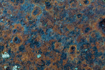 Close-up of rusty metal surface with corrosion patterns