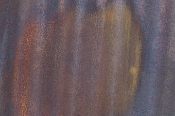 The surface has a lot of rust and he is old and worn. Scene is somewhat bleak and worn, as the rust