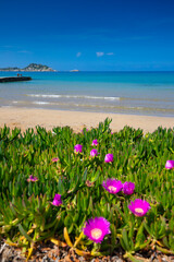 Sandy beach and sea view in the tiny village of Arillas on the west coast of the Greek island of Corfu, background or wallpaper for your project © anettastar