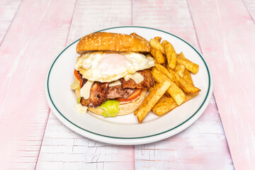 Image of a burger combo with brioche bun, beef, fries, and a vanilla milkshake, typical of an American diner.
