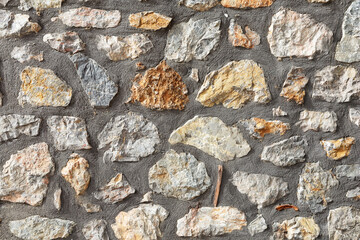 Old stone wall made of large gray natural stones. Stone wall  texture background.