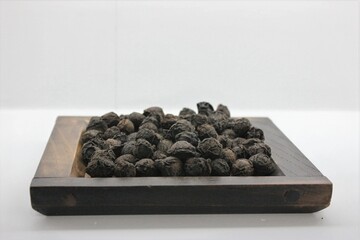 Prunus mume, called Omae, is a dried unripe fruit used in traditional medicine to astringe the lung and intestine, relieve cough and diarrhea, generate fluids, stop thirst, and support recovery.