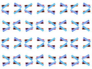 A pattern of assorted shapes and colors, including squares, triangles