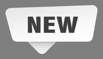 new sign. new white sticker isolated on gray background