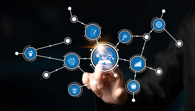 A conceptual representation of digital technology showcasing an interactive hand touching data analysis icons within an information network on a dark background. Tessel