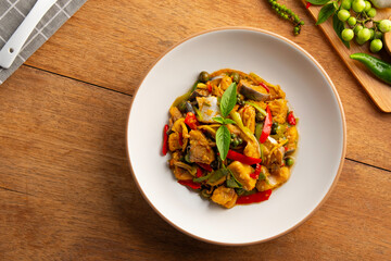 Thai Spicy stir fried Siriped catfish with chilli green peppercorn Fingerroot and kaffir lime leaves.(Pla Sawai Pad Cha).Top view.