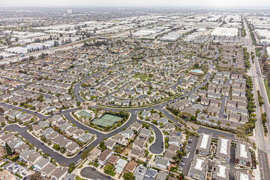 Carson, Los Angeles LA County, CA, California, May 9, 2024: Aerial Drone City View toward Townhouses, California State University,  Houses, Streets
