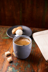 Cup of coffee on rustic wooden background. Soft focus. Copy space	