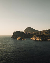 Scenic Coastal Cliffs and Mountains at Sunset in Ibiza
