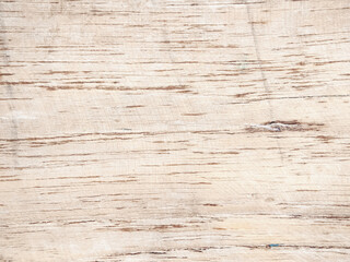 Naklejka premium Close-up of a weathered wooden surface revealing natural grain patterns and textures.