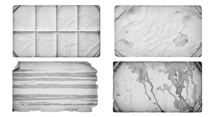 Monochromatic aged paper and parchment textures with folds, fibers, frayed edges, water damage, macro studio shot on white. Concept of material decay