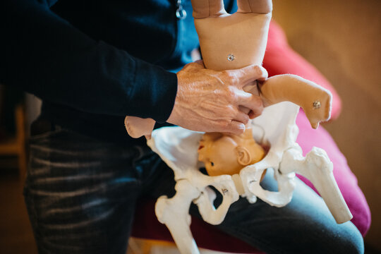male midwife giving information about pregnancy birth