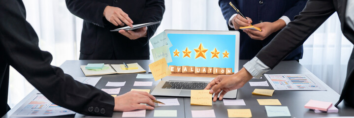 Analyst team use sticky note for creative and analytic brainstorm for business idea with BI data dashboard on laptop screen. Analysis financial data visualization tech for marketing strategy. Prodigy