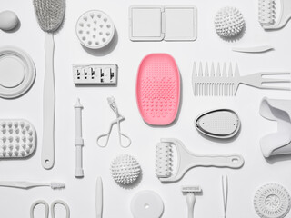 Minimalist Composition of Beauty Tools Highlighting a Single Pink Item