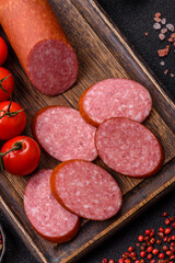 Sliced salami sausage, smoked dry meat as food background. Sliced salami
