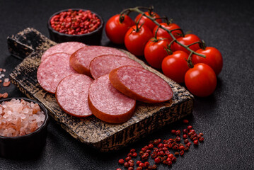 Sliced salami sausage, smoked dry meat as food background. Sliced salami