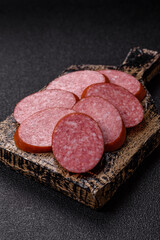 Sliced salami sausage, smoked dry meat as food background. Sliced salami