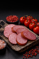 Sliced salami sausage, smoked dry meat as food background. Sliced salami
