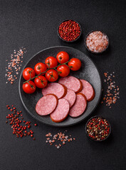 Sliced salami sausage, smoked dry meat as food background. Sliced salami