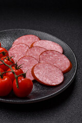 Sliced salami sausage, smoked dry meat as food background. Sliced salami