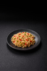 Asian food, chinese or thai rice noodles with vegetables and meat. Rice noodles