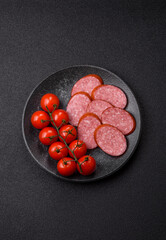 Sliced salami sausage, smoked dry meat as food background. Sliced salami