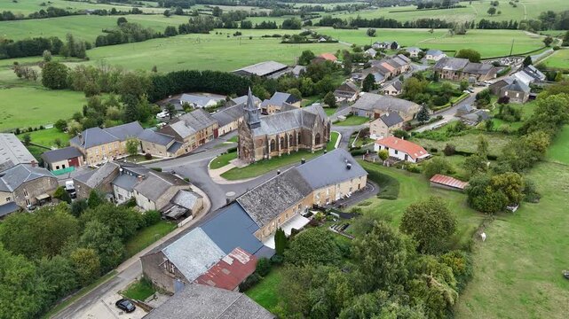 4K aerial drone footage of Saint-Marcel, France, capturing green countryside landscapes and a beautiful sunset over rural fields