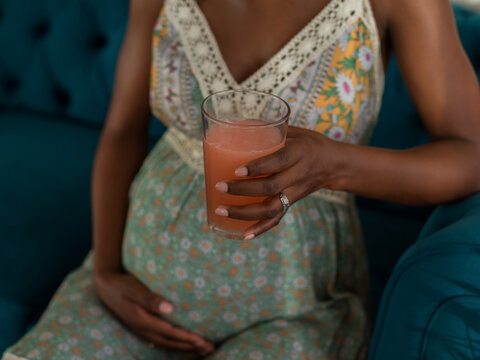 Woman holding glass with dissolving carbon tablet vitamins 