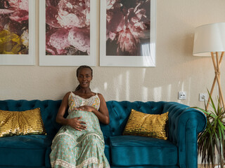 Portrait of gorgeous pregnant woman at luxury apartment