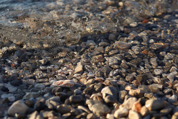 Small stones in the Adriatic Sea, clear water, pebbles, pebble beach