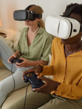 Friends Enjoys Virtual Reality Gaming in Cozy Living Room Setting