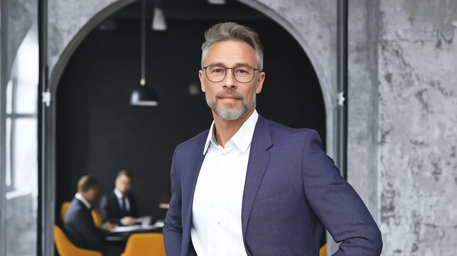 Businessman standing confidently in office meeting room