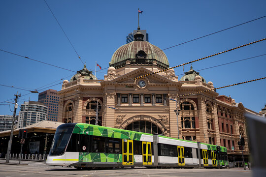 Flinder street station with a tram in front