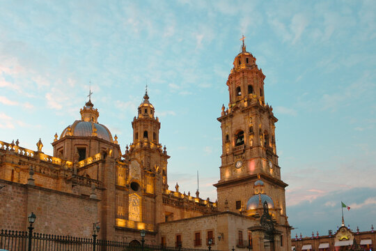 Exterior photo of the Morelia Cathedral basking in the evening glow at sunset in Michoacan