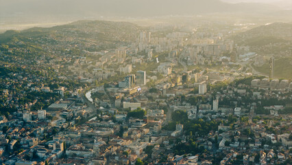 Aerial panoramic view of Sarajevo modern cityscape with Miljacka river