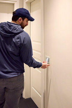 Tourist tapping his car at his room