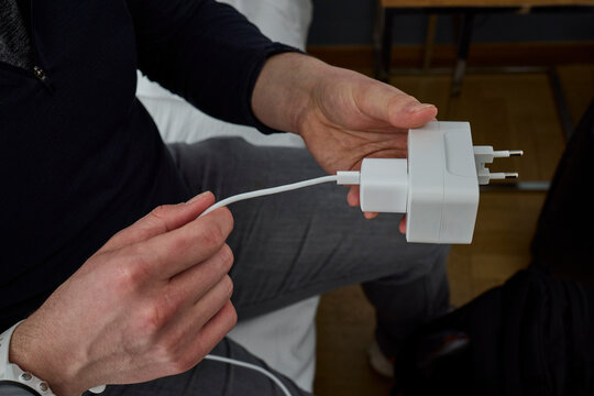 Man using power adaptor 