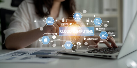 A businesswoman engages with cloud computing technologies, showcasing various icons and charts in...