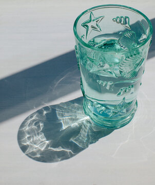 Glass of water with sea design