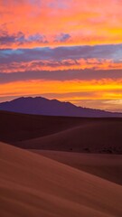 Naklejka premium Sunrise over desert dunes