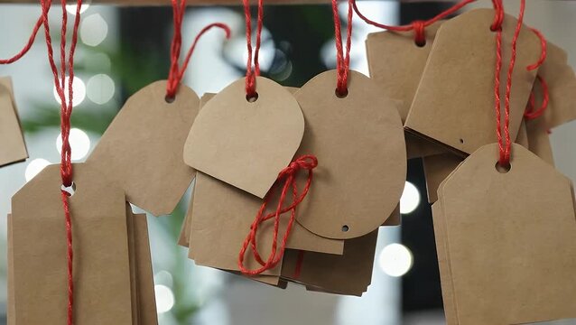 Environmentally Conscious Gift Label Embellishments Crafted from Recycled Brown Paper Material with Twine