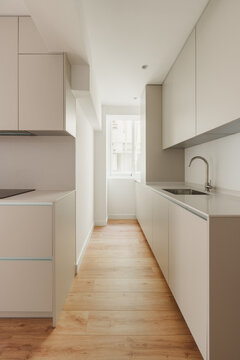 Clean and modern galley kitchen with ample storage
