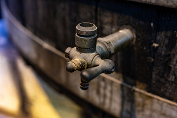Old oak barrels for aging of natural sweet red grand cru wine Banyuls fortified dessert wine from old vines from slopes of the Catalan Pyrenees in Roussillon, France.