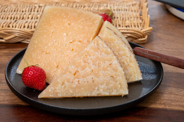 Very old anejo tostado Spanish hard cheese, cow and sheep curado, manchego, goat cheese close up