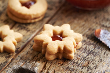 Star shaped Linzer Christmas cookie filled with strawberry marmalade