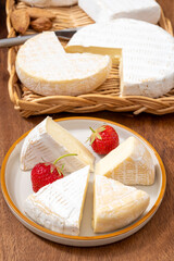 French soft cheeses collection, creamy cow's milk cheese le paysan and brie with white mold, France