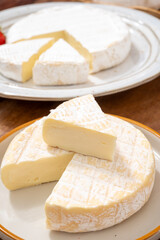 French soft cheeses collection, creamy cow's milk cheese le paysan and brie with white mold, France