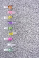 Nail polish bottles on Christmas decoration, holiday manicure concept