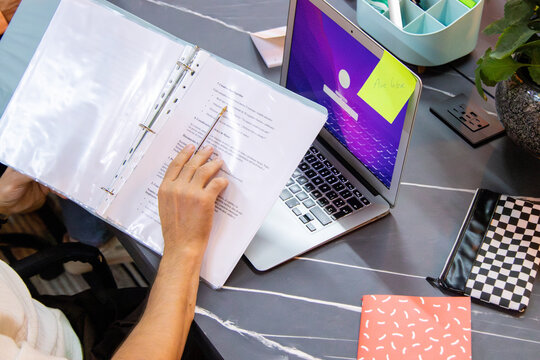 Unknown entrepreneur reviewing the documents of a marketing project