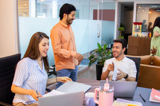 A coworking office with several coworkers living happily together